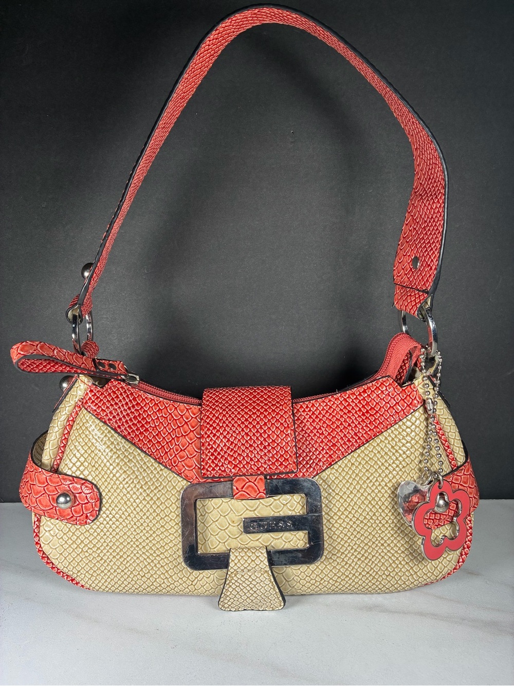 GUESS Coral and Cream Faux Snakeskin Baguette with Floral Bag Charm